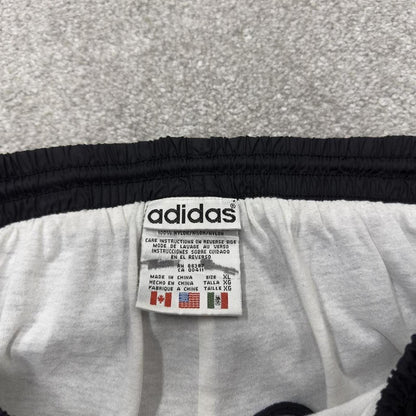 Vintage Adidas tracksuit bottoms loose black Loose floaty embroidered side stripe track pants