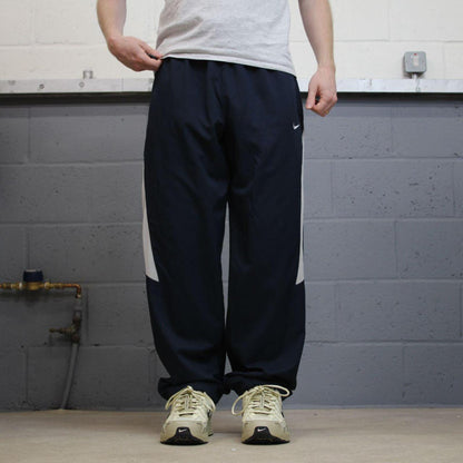 Nike tracksuit bottoms wide leg navy Floaty unlined embroidered side stripe track pants