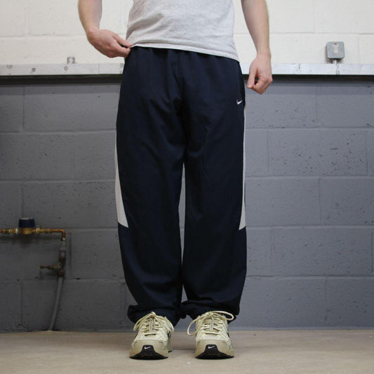 Nike tracksuit bottoms wide leg navy Floaty unlined embroidered side stripe track pants