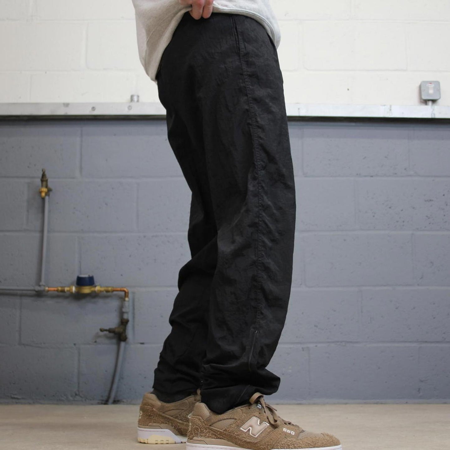 Vintage Nike tracksuit bottoms y2k black medium floaty leg unlined swoosh logo gym wear track pants