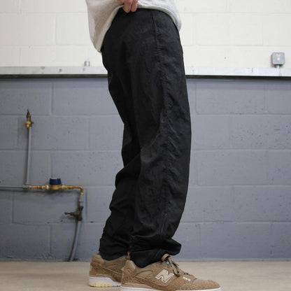 Vintage Nike tracksuit bottoms y2k black medium floaty leg unlined swoosh logo gym wear track pants
