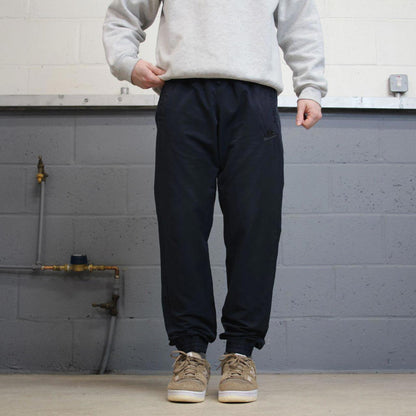 Y2k Nike tracksuit bottoms loose navy Loose unlined embroidered cuffed track pants