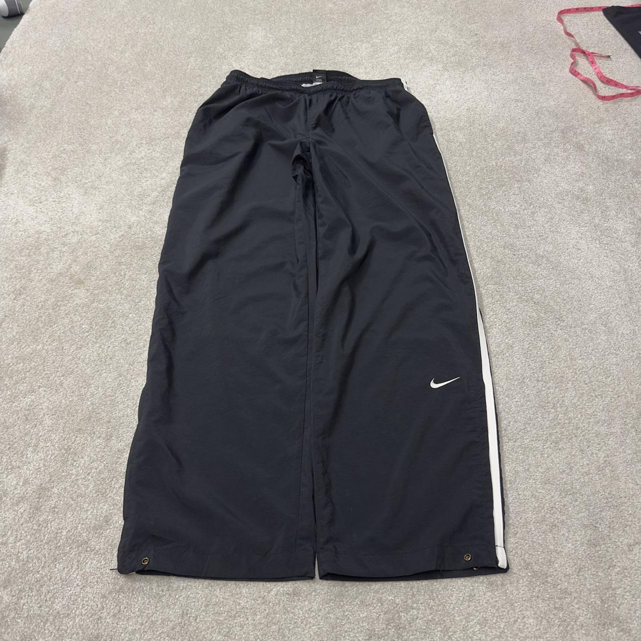Nike extra baggy tracksuit bottoms wide leg black Nike Team lined embroidered stripe track pants