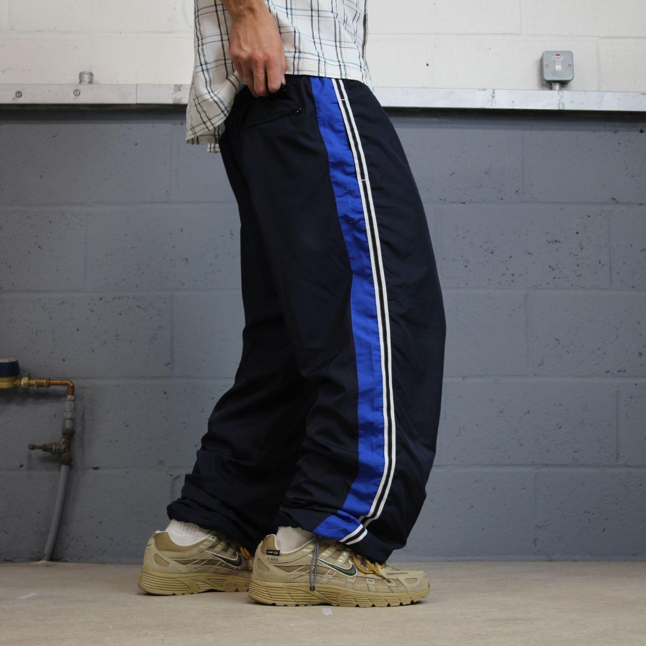 Baggy Y2K Champion tracksuit bottoms navy Loose leg lined 2000s style casual track pants