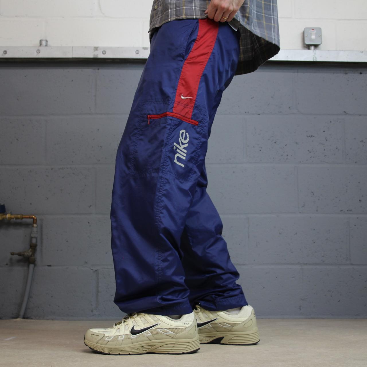 Y2K vintage Nike baggy tracksuit bottoms navy Loose leg 2000s style casual swoosh logo track pants