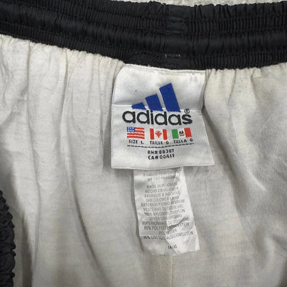 Black Adidas tracksuit bottoms Large y2k style sportswear track pants side stripe design