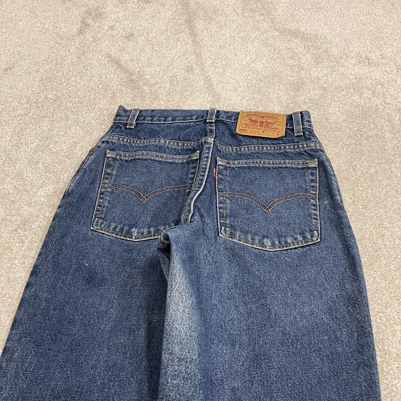 Y2K vintage Levi’s 550 jeans W26L31 blue Relaxed fit tapered leg 5 pocket pants red tab logo