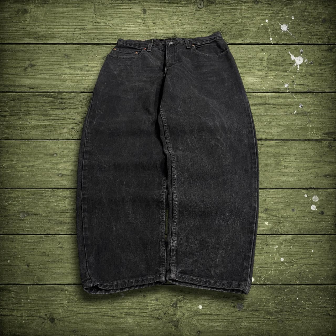 Vintage Levi's 560 jeans y2k black Loose fit denim pants red tab logo