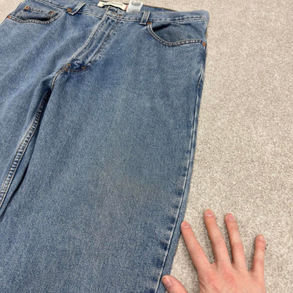 Vintage Y2K Levi’s 550 jeans blue W38L30 Loose straight leg 00s style denim pants red tab logo