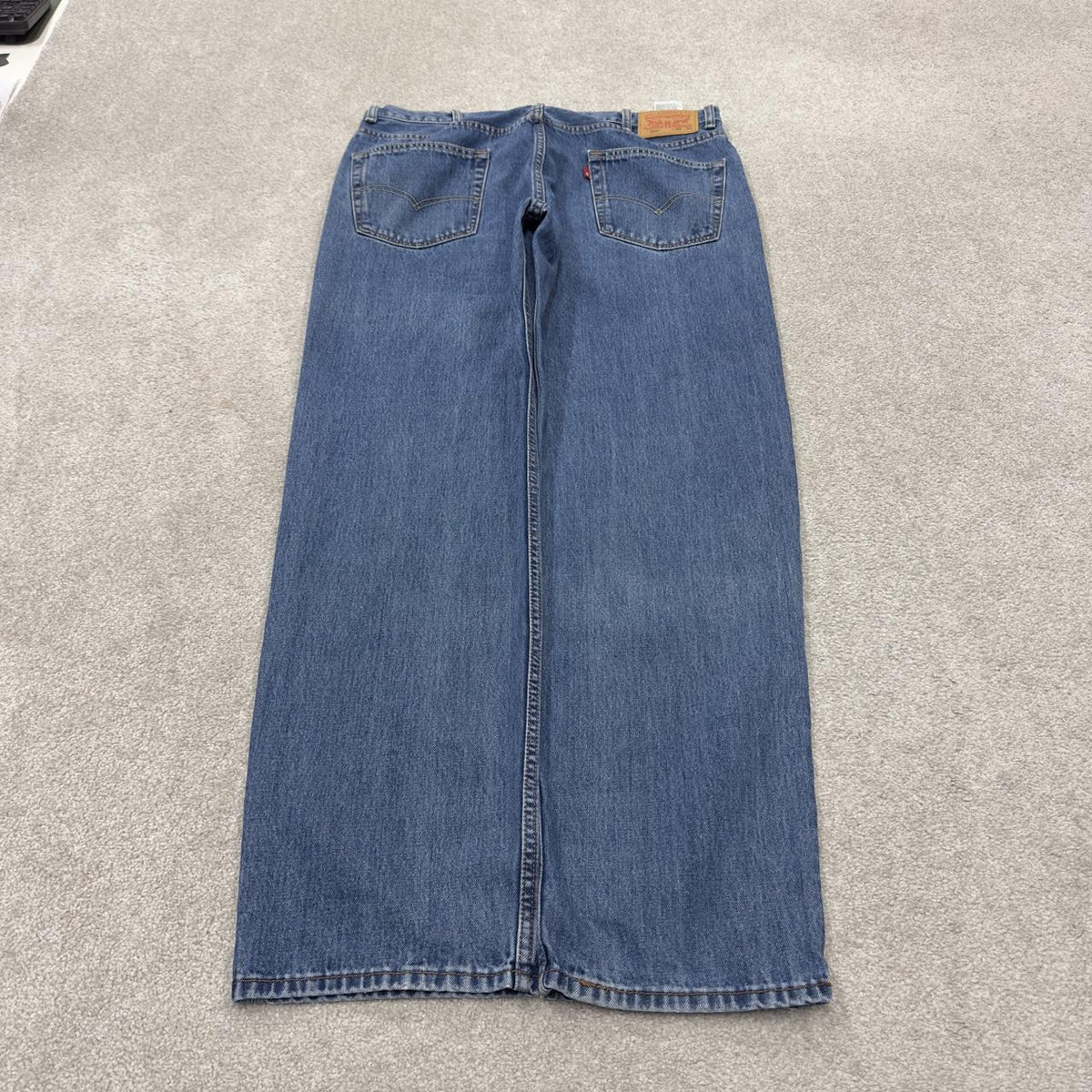 Levi’s 550 jeans Y2K blue denim loose leg 2000s style pants red tab logo