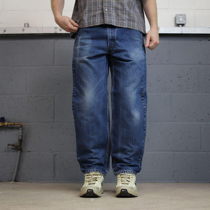 Levi’s 550 jeans Y2K blue denim Levi’s loose straight leg 2000s style pants red tab logo