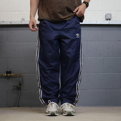 Adidas tracksuit bottoms loose leg navy Vintage mesh lined embroidered side stripe track pants