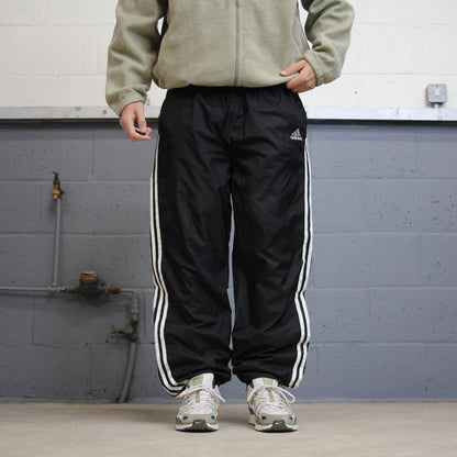 Black Adidas tracksuit bottoms Large y2k style sportswear track pants side stripe design