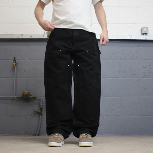 Black Carhartt double knee carpenter jeans W34L34 90s style thick canvas loose leg skater cargos