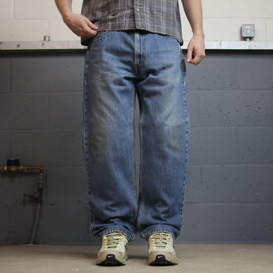 Levi’s 550 denim jeans y2k W36L30 blue loose straight leg red tab logo pants