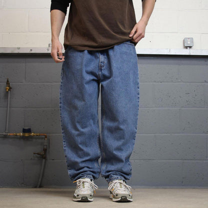 Y2K Levi’s 550 jeans tapered leg blue Loose relaxed fit denim pants red tab logo