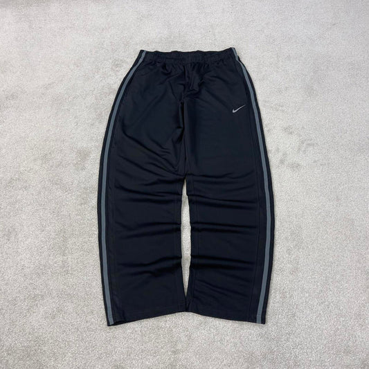 Baggy Nike Trackies Large Black y2k 00s style loose wide leg joggers embroidered logo side stripe