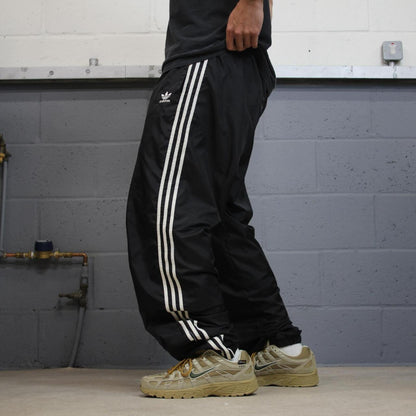 Vintage Adidas tracksuit bottoms loose black Loose floaty embroidered side stripe track pants