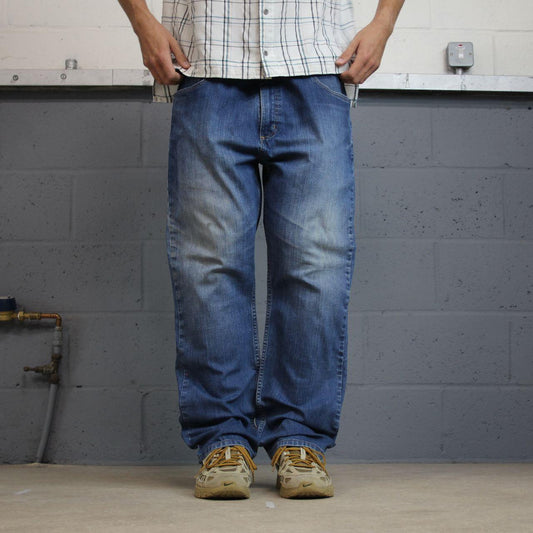 Vintage Carhartt relaxed denim jeans y2k blue Straight leg skater style 2000s style workwear jeans