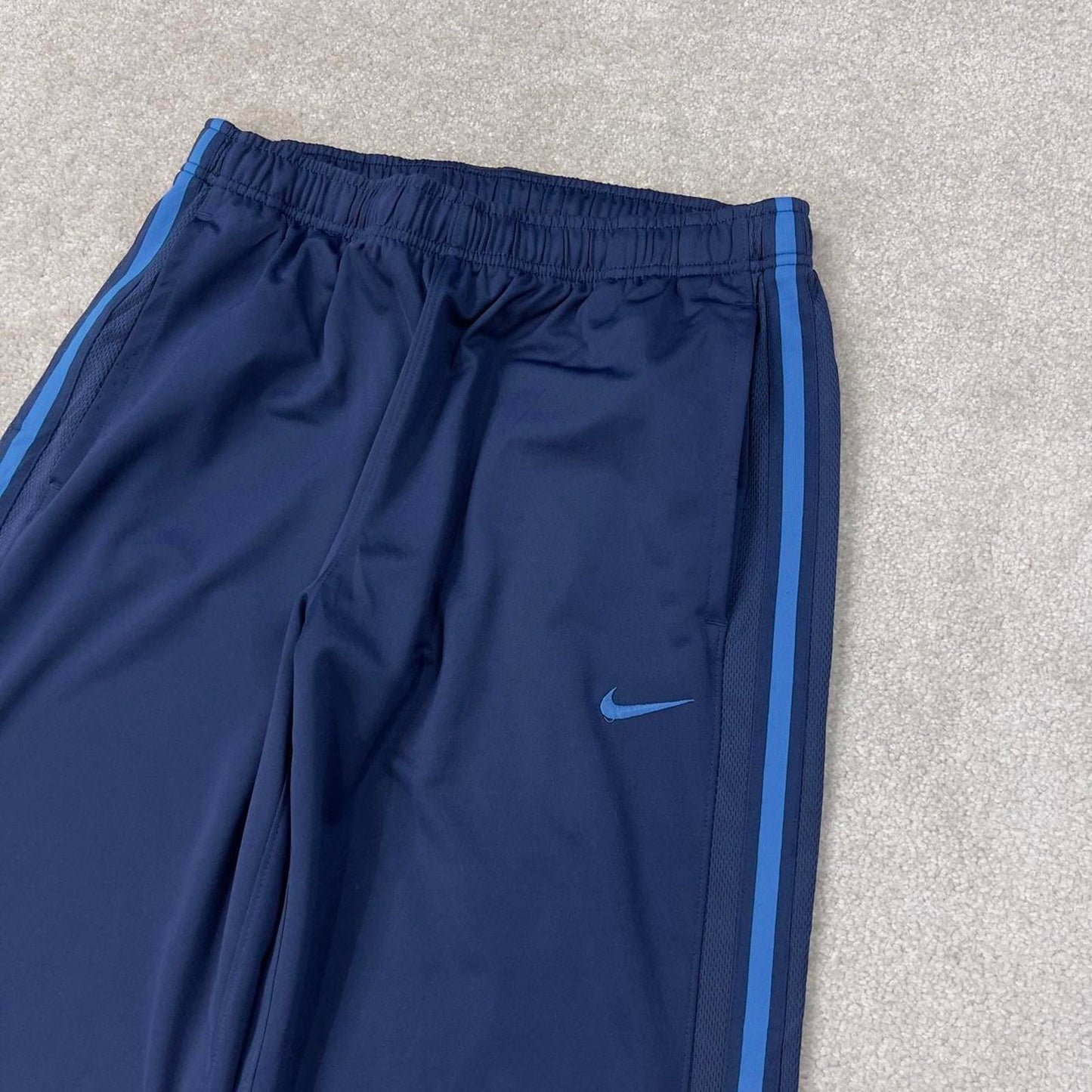 Baggy Nike Trackies Large Navy loose wide leg y2k style joggers embroidered logo side stripe design