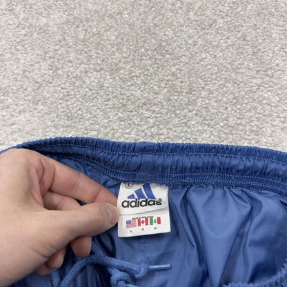 Vintage y2k Adidas tracksuit bottoms blue Loose leg embroidered side stripe 2000s style track pants