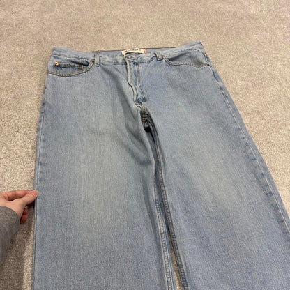 Vintage Y2K Levi’s 550 jeans blue Loose straight leg 00s style denim pants red tab logo