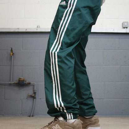 Green Adidas Team trackies M y2k style sportswear track pants embroidered logo side stripe design