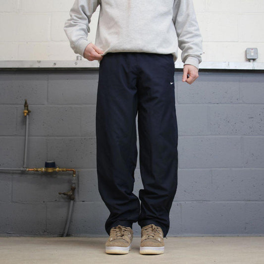 Vintage y2k Nike tracksuit bottoms navy Loose floaty leg unlined Swoosh logo track pants
