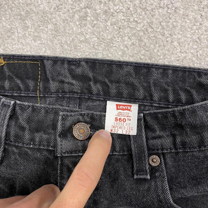 Vintage Levi's 560 jeans loose fit tapered leg black USA made 100% cotton denim pants red tab logo