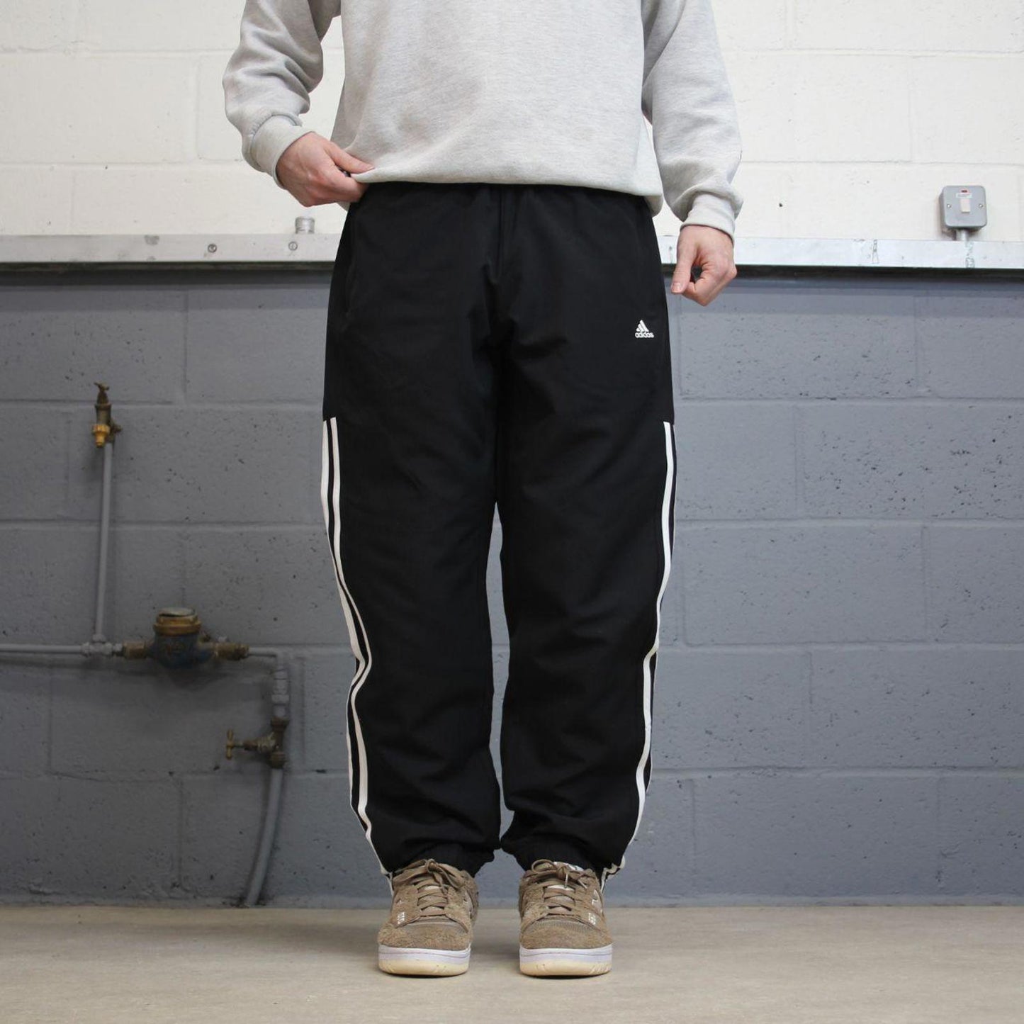 Black Adidas trackies Large y2k loose style sportswear track pants embroidered side stripe design