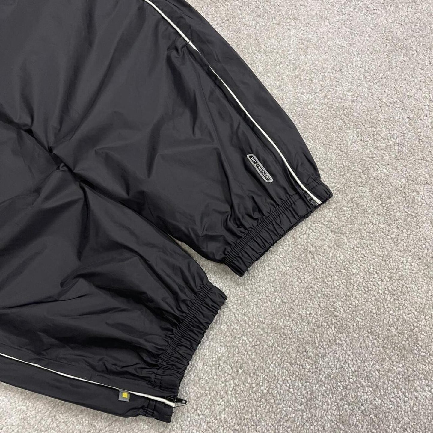 Reebok tracksuit bottoms Y2K black Loose unlined lightweight side stripe track pants