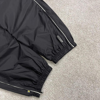Reebok tracksuit bottoms Y2K black Loose unlined lightweight side stripe track pants