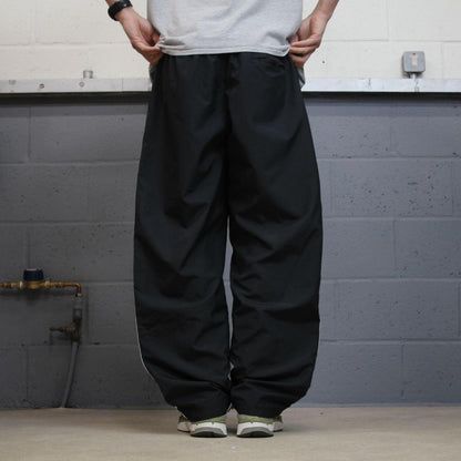 Baggy Nike tracksuit bottoms black Wide leg mesh lined embroidered side stripe track pants