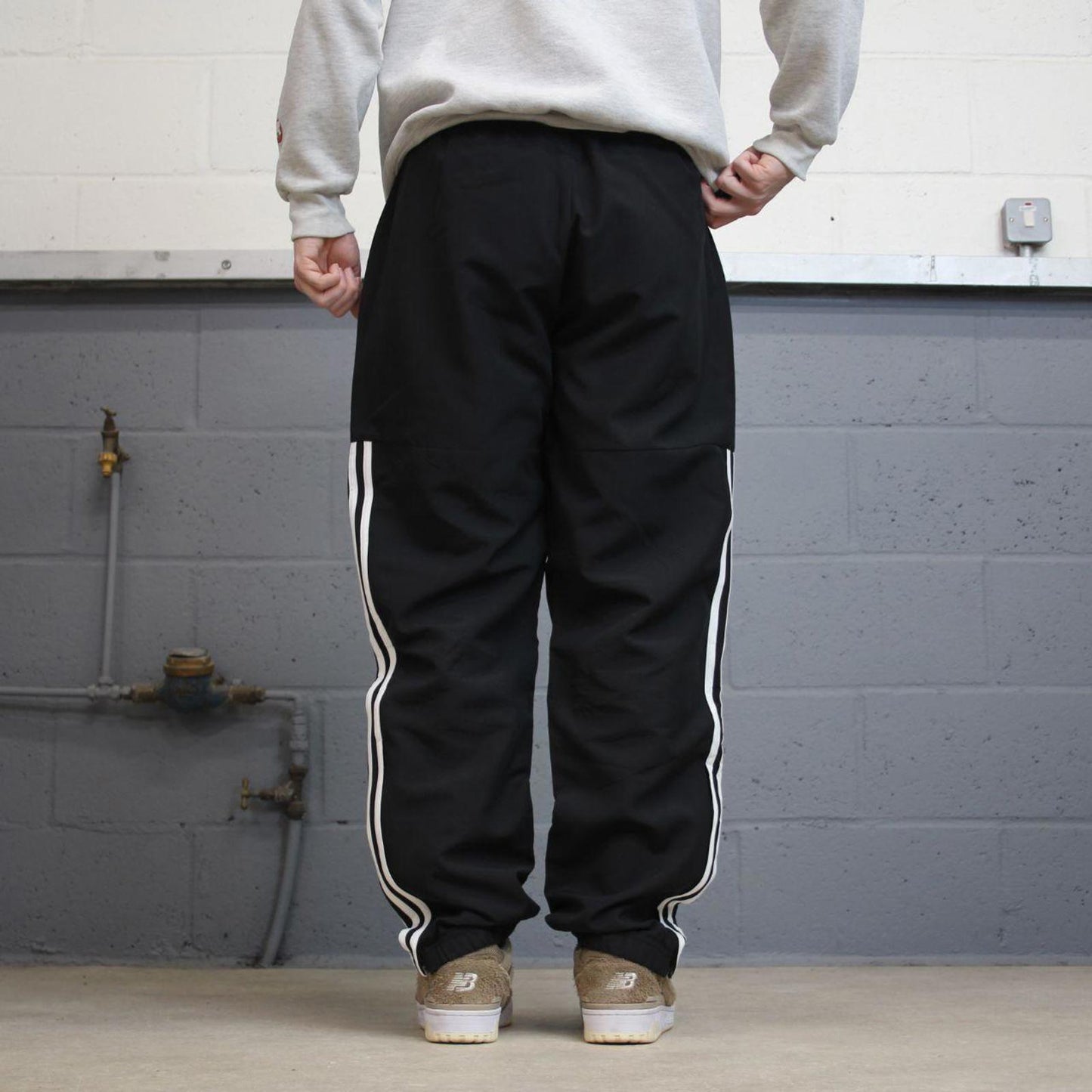 Black Adidas trackies Large y2k loose style sportswear track pants embroidered side stripe design