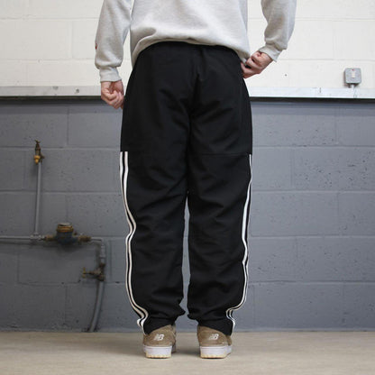 Black Adidas trackies Large y2k loose style sportswear track pants embroidered side stripe design