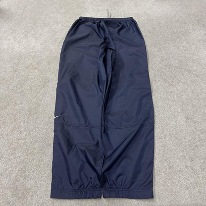 Vintage Nike tracksuit bottoms Y2K navy Loose leg unlined embroidered swoosh track pants