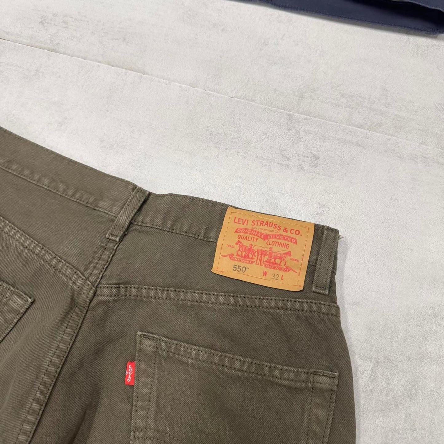Vintage Levi's 550 denim jean shorts W31 green denim 90s style jorts red tab logo