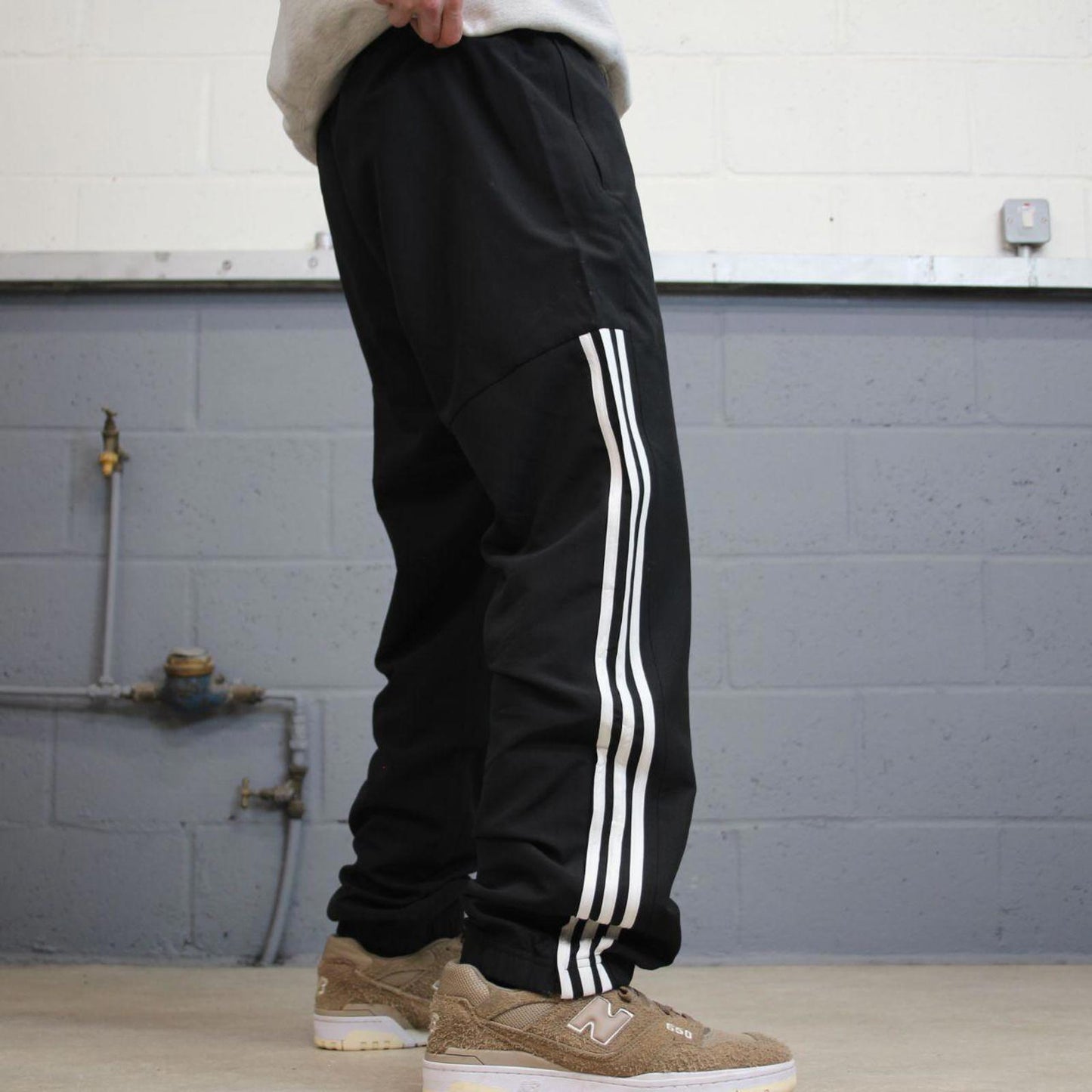 Black Adidas trackies Large y2k loose style sportswear track pants embroidered side stripe design
