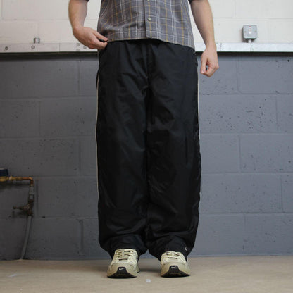 Vintage Y2K Nike baggy tracksuit bottoms black M 8-10 Loose leg lined track pants swoosh logo