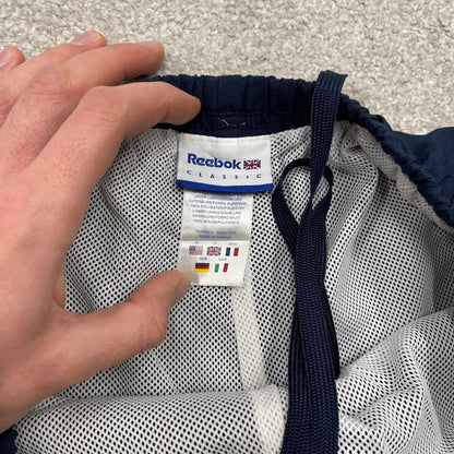 Vintage y2k Reebok tracksuit bottoms navy Loose lined embroidered track pants ankle zips