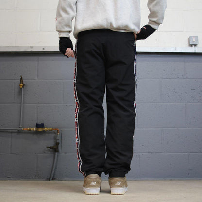 Vintage Champion tracksuit bottoms y2k style black joggers embroidered side stripe track pants