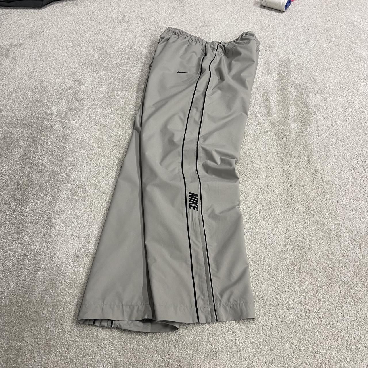 Vintage Nike baggy tracksuit bottoms Y2K grey Wide leg lined embroidered side stripe track pants