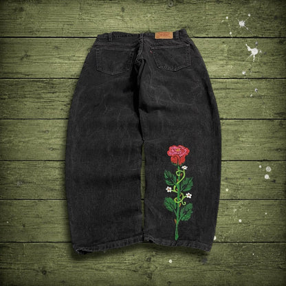 Vintage Levi's 560 jeans y2k black Loose fit denim pants red tab logo