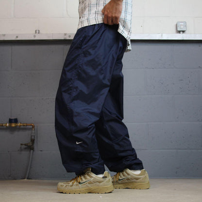 Vintage Nike tracksuit bottoms Y2K navy Loose leg unlined embroidered swoosh track pants
