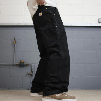 Black Carhartt double knee carpenter jeans W34L34 90s style thick canvas loose leg skater cargos