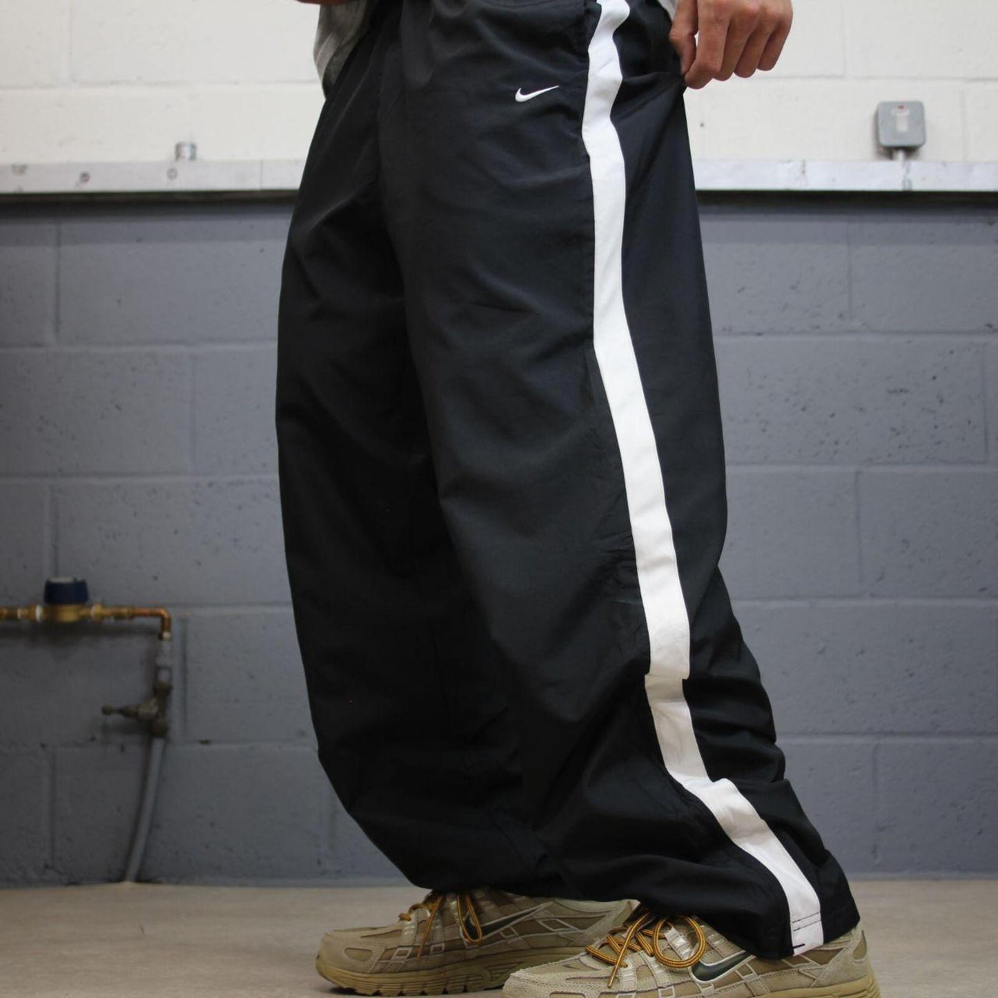 Nike tracksuit bottoms Y2K black Loose fit mesh lined embroidered side stripe track pants