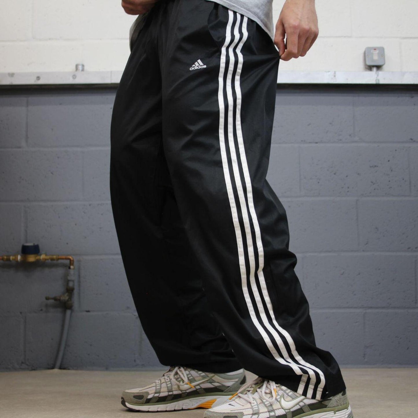 Adidas tracksuit bottoms loose black Loose floaty leg embroidered side stripe track pants