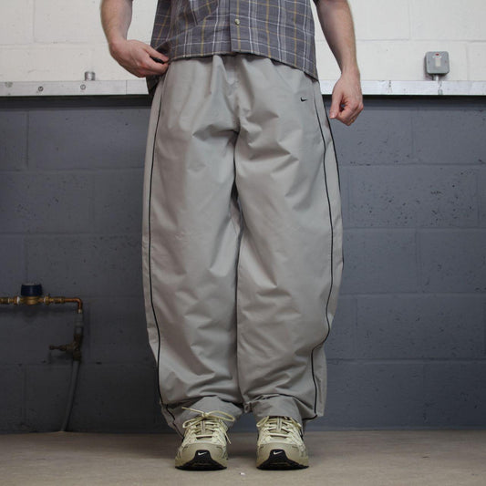 Vintage Nike baggy tracksuit bottoms Y2K grey Wide leg lined embroidered side stripe track pants