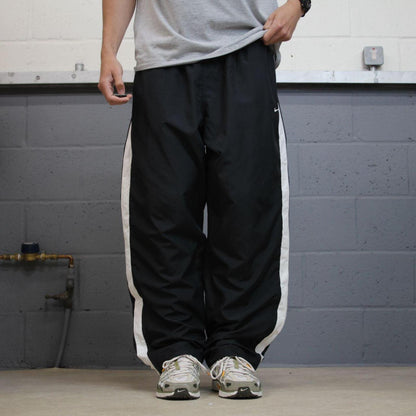 Baggy Nike tracksuit bottoms black Wide leg mesh lined embroidered side stripe track pants