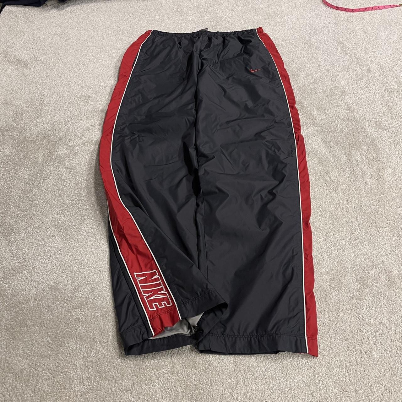 Vintage Nike baggy tracksuit bottoms Y2K black Wide leg lined embroidered side stripe track pants